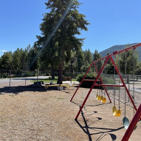 Image of playground swings at Nugget RV Park