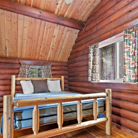 Image of cabin bedroom interior at Nugget RV Park