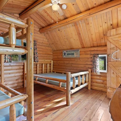 Image of cabin interior with ceiling fan at Nugget RV Park