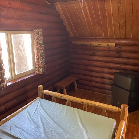 Image of cabin interior on bed at Nugget RV Park