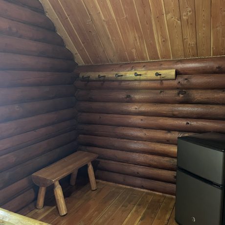 Image of cabin interior with refrigerator at Nugget RV Park