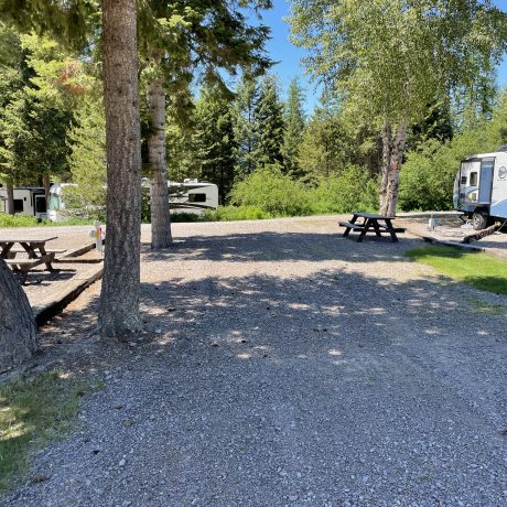 Image of gravel and dirt roads with RVs parked at Nugget RV Park