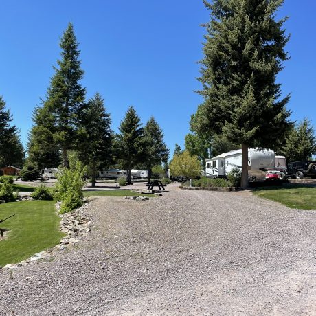 Image of gravel and dirt roads with RV parked at Nugget RV Park